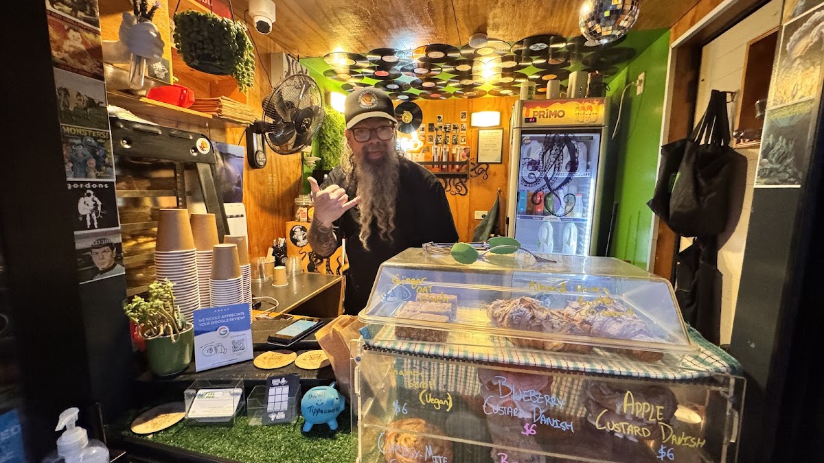 Jimmy behind the counter at Kraken Coffee